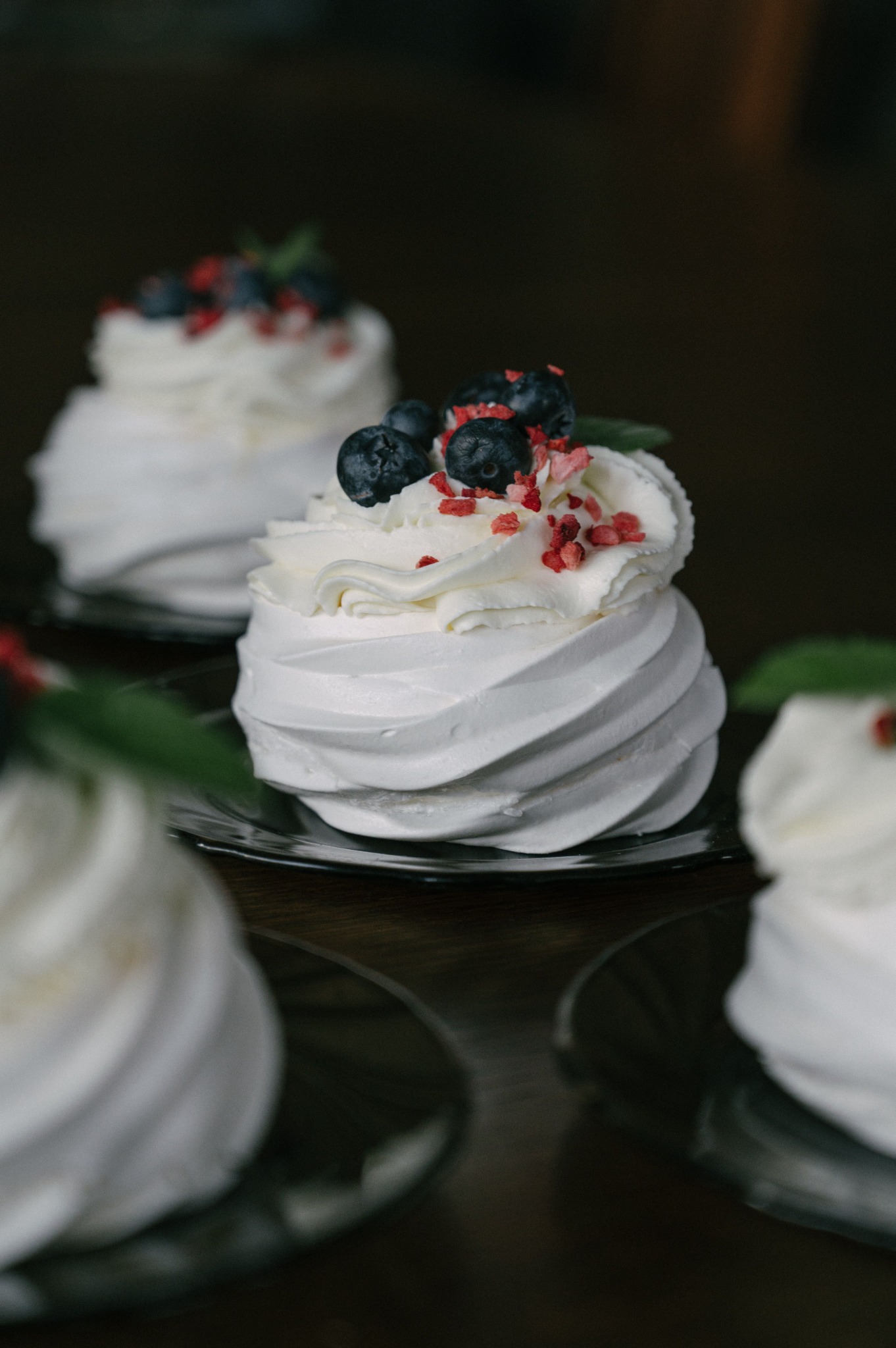 White meringue desserts with berries
